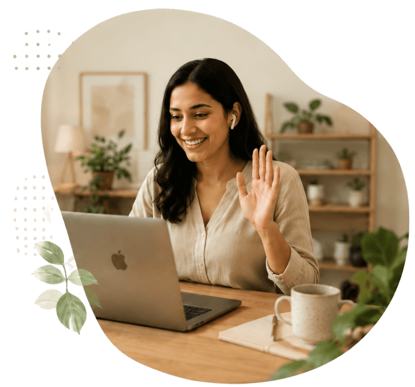 A licensed Kappiness psychologist smiling and waving during an online counselling session in Kerala